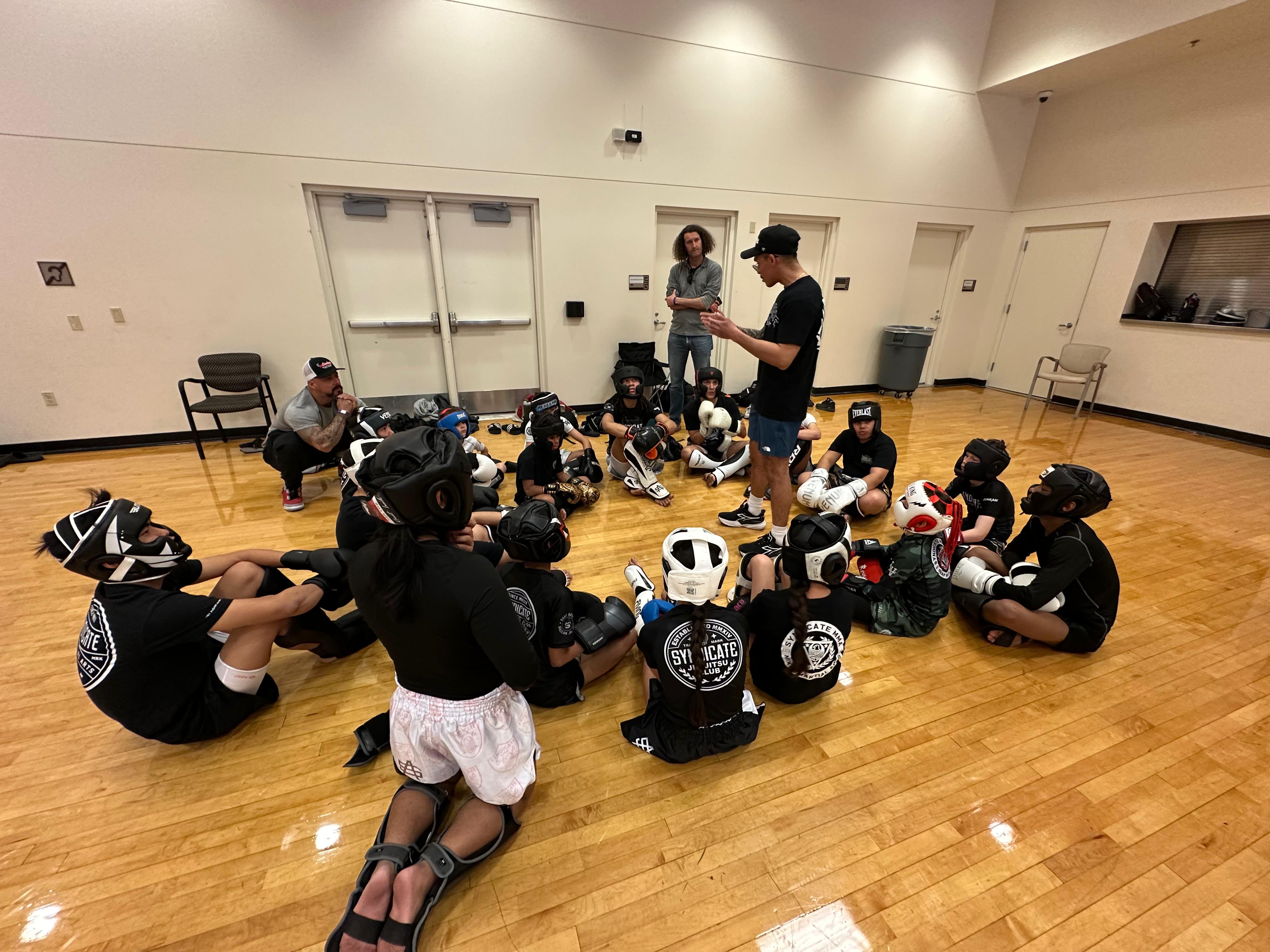 Xavier coaching kids at school program