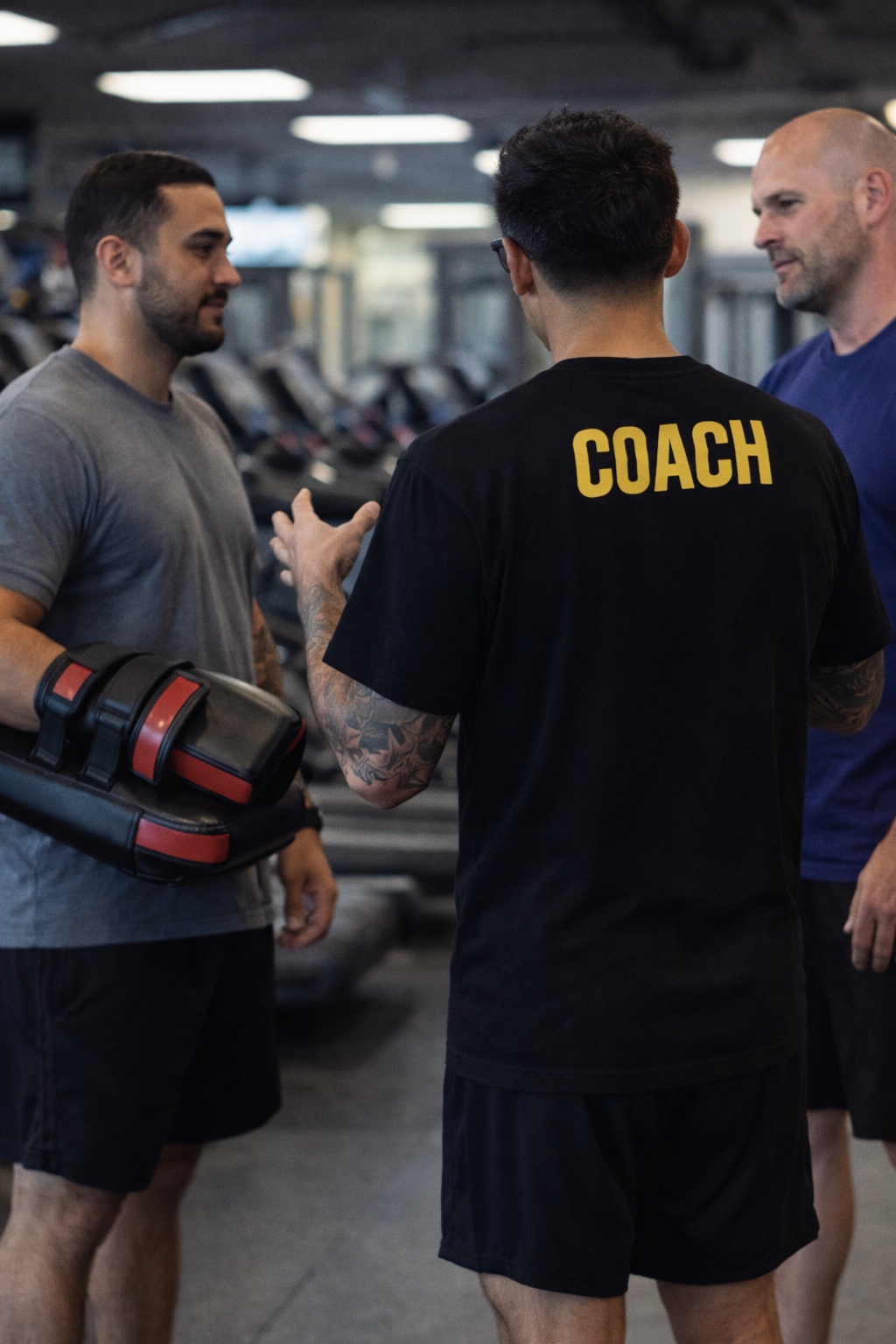 Xavier coaching personal trainers on pad holding technique